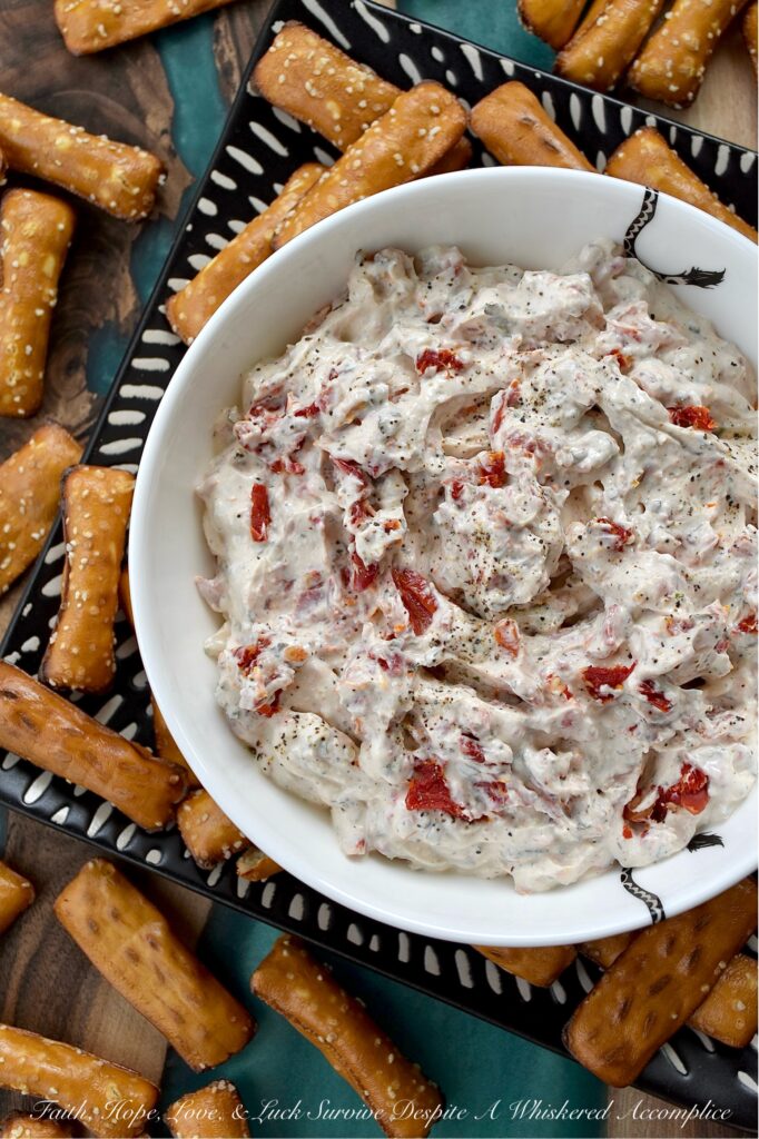 Sun-Dried Tomato Dip with Italian Seasoning - Looking for a quick, easy, and incredibly delicious dip that's perfect for any occasion? This sun-dried tomato dip with Italian seasoning is the perfect crowd-pleaser for any occasion with its creamy combination of tangy sour cream and sweet mayonnaise. Finely chopped sun-dried tomatoes add a delightful burst of texture and intense, sun-kissed tomato flavor. Whether you're hosting a party, cheering on your favorite team, or just enjoying a family game night, this Italian-seasoned dip is guaranteed to be an instant hit.