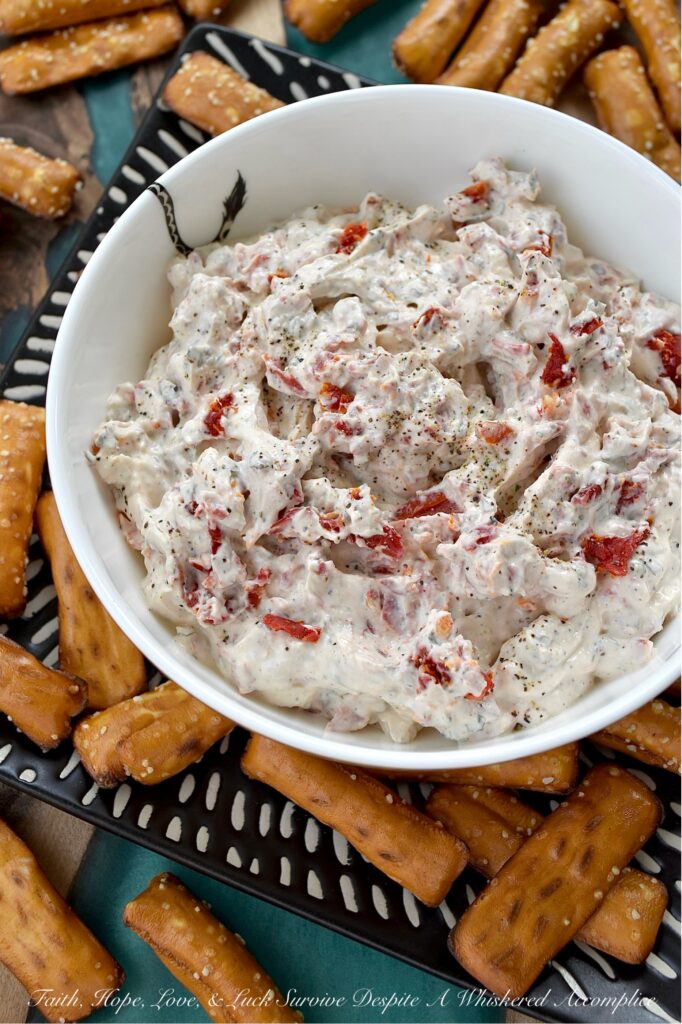 Sun-Dried Tomato Dip with Italian Seasoning - Looking for a quick, easy, and incredibly delicious dip that's perfect for any occasion? This sun-dried tomato dip with Italian seasoning is the perfect crowd-pleaser for any occasion with its creamy combination of tangy sour cream and sweet mayonnaise. Finely chopped sun-dried tomatoes add a delightful burst of texture and intense, sun-kissed tomato flavor. Whether you're hosting a party, cheering on your favorite team, or just enjoying a family game night, this Italian-seasoned dip is guaranteed to be an instant hit.