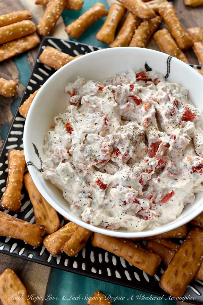Sun-Dried Tomato Dip with Italian Seasoning - Looking for a quick, easy, and incredibly delicious dip that's perfect for any occasion? This sun-dried tomato dip with Italian seasoning is the perfect crowd-pleaser for any occasion with its creamy combination of tangy sour cream and sweet mayonnaise. Finely chopped sun-dried tomatoes add a delightful burst of texture and intense, sun-kissed tomato flavor. Whether you're hosting a party, cheering on your favorite team, or just enjoying a family game night, this Italian-seasoned dip is guaranteed to be an instant hit.