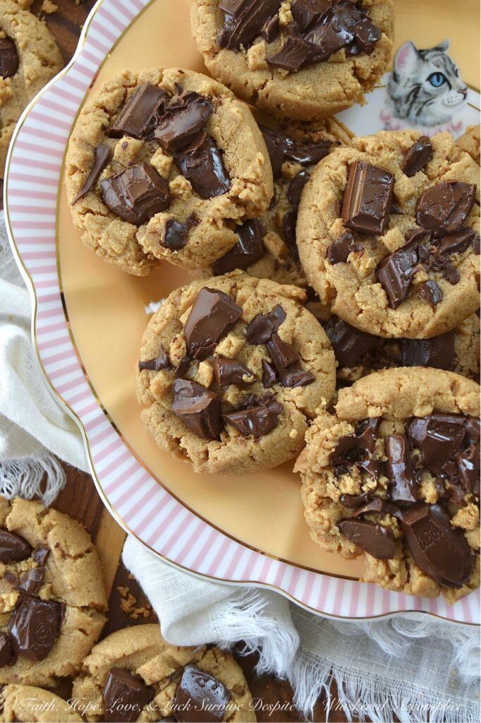 Classic Peanut Butter Cookies (Eggless Recipe) - These peanut butter cookies are a total game changer for anyone dealing with egg or gluten allergies. Rich and flavorful, not only are these eggless cookies somewhat allergy-friendly, but they're also insanely delicious, making them a fantastic treat for anyone who loves peanut butter. And, when you add a bit of dark chocolate to them while they’re still warm from the oven, it creates an amazing blend of peanut butter and chocolate that’s pretty much irresistible. The classic peanut butter and chocolate flavor combination really takes these cookies to a whole new level of yumminess.