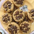 Classic Peanut Butter Cookies (Eggless Recipe) - These peanut butter cookies are a total game changer for anyone dealing with egg or gluten allergies. Rich and flavorful, not only are these eggless cookies somewhat allergy-friendly, but they're also insanely delicious, making them a fantastic treat for anyone who loves peanut butter. And, when you add a bit of dark chocolate to them while they’re still warm from the oven, it creates an amazing blend of peanut butter and chocolate that’s pretty much irresistible. The classic peanut butter and chocolate flavor combination really takes these cookies to a whole new level of yumminess.