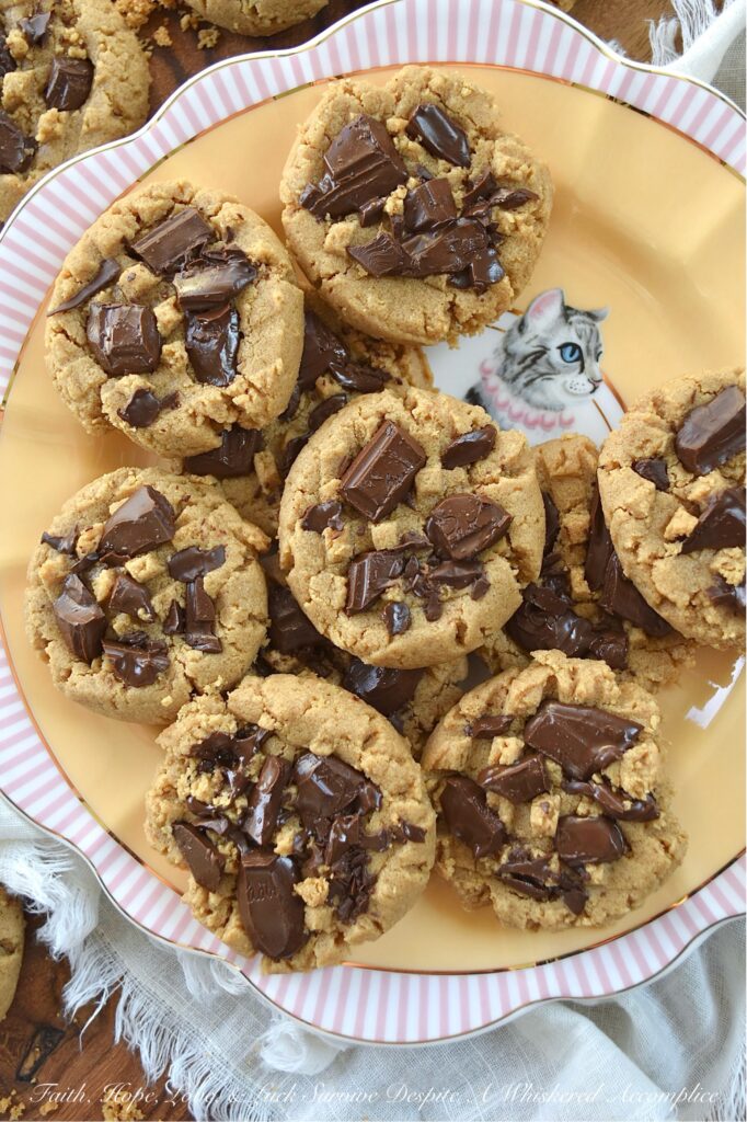 Classic Peanut Butter Cookies (Eggless Recipe) - These peanut butter cookies are a total game changer for anyone dealing with egg or gluten allergies. Rich and flavorful, not only are these eggless cookies somewhat allergy-friendly, but they're also insanely delicious, making them a fantastic treat for anyone who loves peanut butter. And, when you add a bit of dark chocolate to them while they’re still warm from the oven, it creates an amazing blend of peanut butter and chocolate that’s pretty much irresistible. The classic peanut butter and chocolate flavor combination really takes these cookies to a whole new level of yumminess.