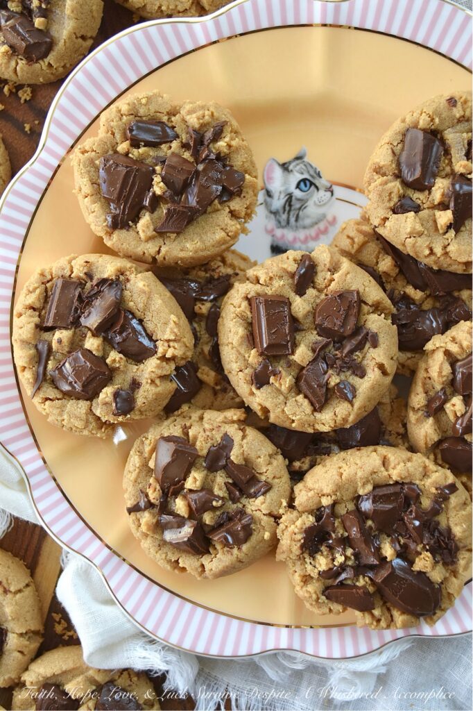 Classic Peanut Butter Cookies (Eggless Recipe) - These peanut butter cookies are a total game changer for anyone dealing with egg or gluten allergies. Rich and flavorful, not only are these eggless cookies somewhat allergy-friendly, but they're also insanely delicious, making them a fantastic treat for anyone who loves peanut butter. And, when you add a bit of dark chocolate to them while they’re still warm from the oven, it creates an amazing blend of peanut butter and chocolate that’s pretty much irresistible. The classic peanut butter and chocolate flavor combination really takes these cookies to a whole new level of yumminess.