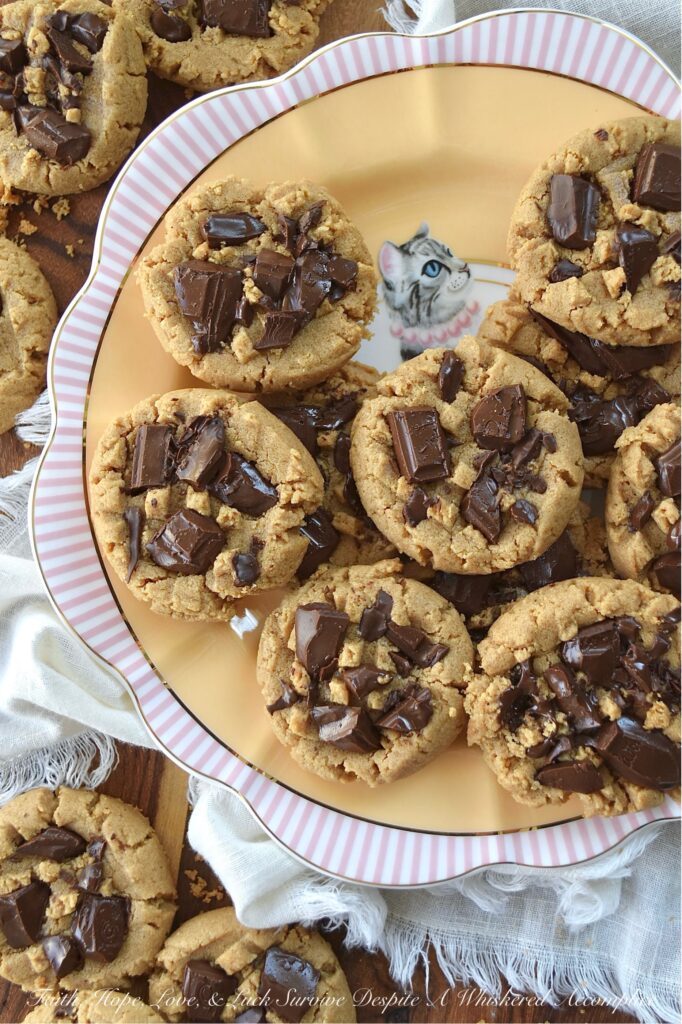 Classic Peanut Butter Cookies (Eggless Recipe) - These peanut butter cookies are a total game changer for anyone dealing with egg or gluten allergies. Rich and flavorful, not only are these eggless cookies somewhat allergy-friendly, but they're also insanely delicious, making them a fantastic treat for anyone who loves peanut butter. And, when you add a bit of dark chocolate to them while they’re still warm from the oven, it creates an amazing blend of peanut butter and chocolate that’s pretty much irresistible. The classic peanut butter and chocolate flavor combination really takes these cookies to a whole new level of yumminess.