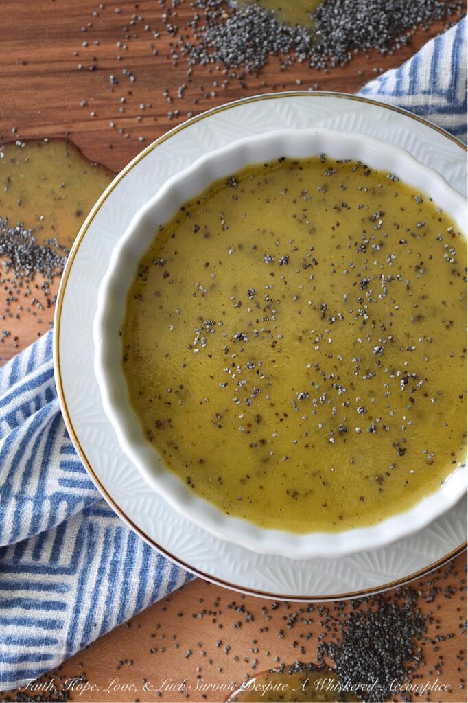 Honey Dijon Poppy Seed Salad Dressing - Are you tired of the same old boring salads? This versatile homemade poppy seed salad dressing recipe combines the sweetness of honey, the richness of olive oil, and the tangy zip of apple cider vinegar, while a touch of Dijon mustard adds depth of flavor, beautiful color, and a welcome hint of saltiness. But it's the poppy seeds that truly make this salad dressing a winner, adding a delightful texture and subtle nutty flavor. This Honey Dijon Poppy Seed Salad Dressing is also incredibly adaptable, perfect for tossing with pasta salad, adding flavor to coleslaw, or even replacing mayonnaise in your favorite potato salad.