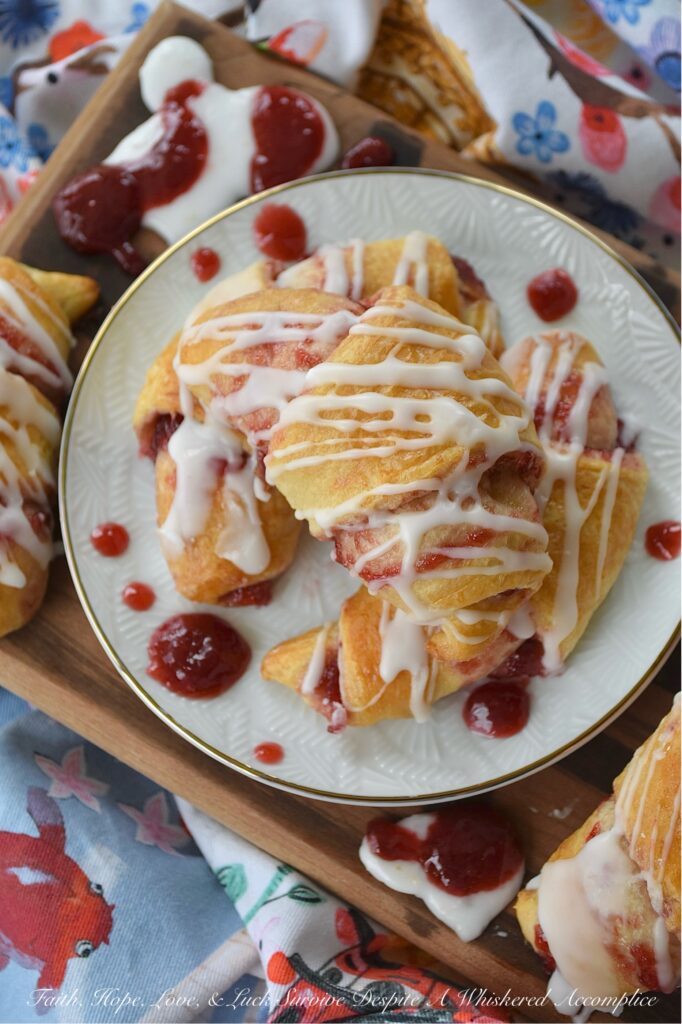 Raspberry Irish Whiskey Jam-Filled Crescent Rolls - Imagine biting into a flaky, golden crescent roll, bursting with the vibrant, sweet tang of homemade raspberry jam, subtly kissed with the warmth of Irish whiskey and the rich caramel notes of light brown sugar. This isn't just jam; it's a flavor experience. And the best part? It's surprisingly simple to create with the help of ordinary everyday store-bought crescent rolls and a simple two-ingredient powdered sugar icing. This jam-filled breakfast crescent roll recipe is one you're definitely going to want to wake up early for.