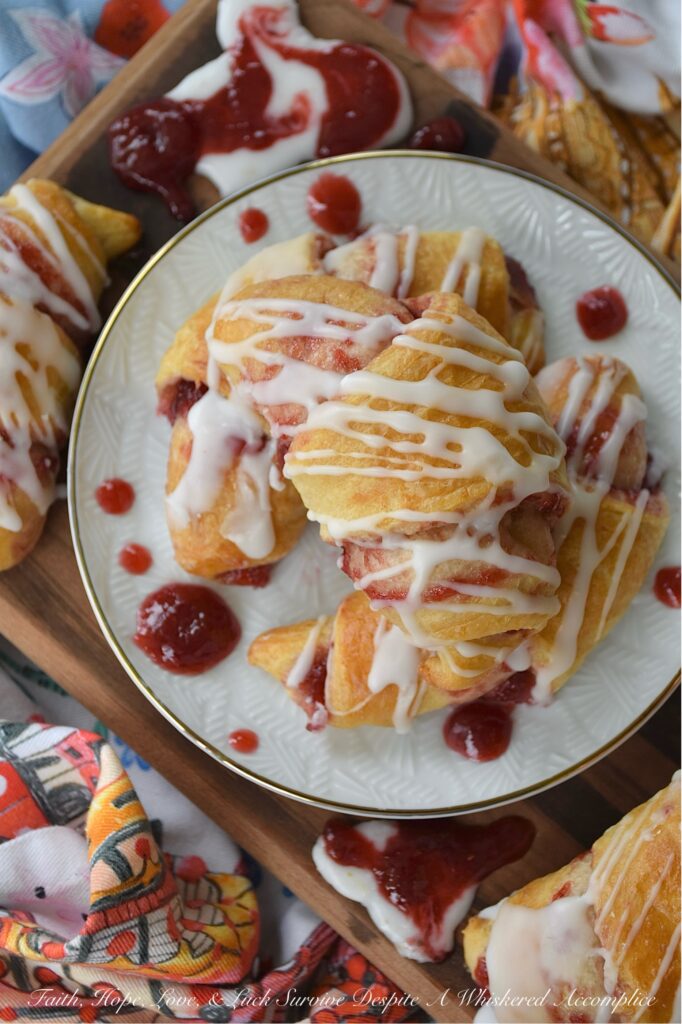 Raspberry Irish Whiskey Jam-Filled Crescent Rolls - Imagine biting into a flaky, golden crescent roll, bursting with the vibrant, sweet tang of homemade raspberry jam, subtly kissed with the warmth of Irish whiskey and the rich caramel notes of light brown sugar. This isn't just jam; it's a flavor experience. And the best part? It's surprisingly simple to create with the help of ordinary everyday store-bought crescent rolls and a simple two-ingredient powdered sugar icing. This jam-filled breakfast crescent roll recipe is one you're definitely going to want to wake up early for.