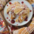 Raspberry Irish Whiskey Jam-Filled Crescent Rolls - Imagine biting into a flaky, golden crescent roll, bursting with the vibrant, sweet tang of homemade raspberry jam, subtly kissed with the warmth of Irish whiskey and the rich caramel notes of light brown sugar. This isn't just jam; it's a flavor experience. And the best part? It's surprisingly simple to create with the help of ordinary everyday store-bought crescent rolls and a simple two-ingredient powdered sugar icing. This jam-filled breakfast crescent roll recipe is one you're definitely going to want to wake up early for.
