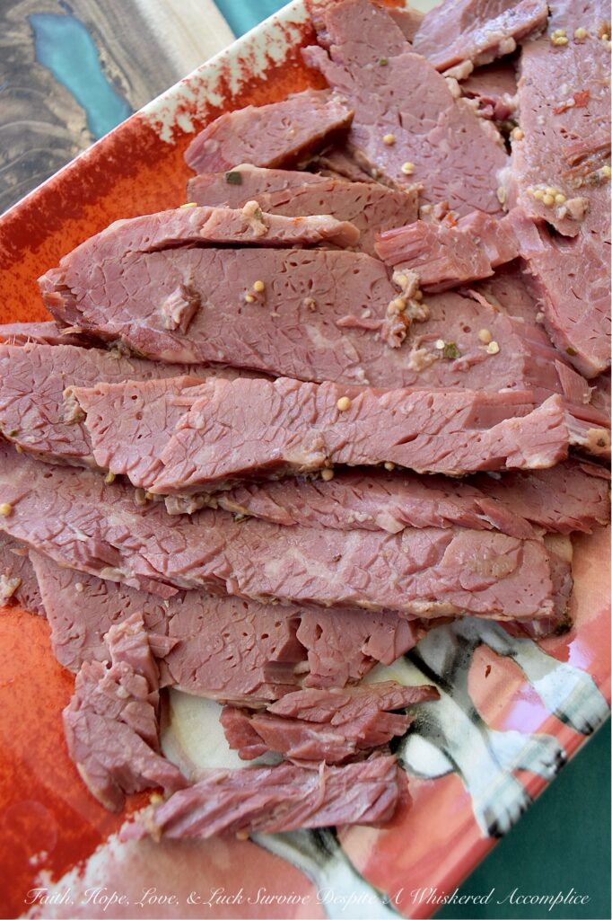 Guinness Stout Crockpot Simmered Corned Beef - Forget complicated recipes and wasted hours spent in the kitchen. With just five simple ingredients and the help of your trusty crockpot or slow cooker, you can transform a tough corned beef brisket into a melt-in-your-mouth masterpiece. This slow-cooked corned beef is simmered to perfection with Guinness Draught Stout, whole black peppercorns, sliced sweet yellow onion, and just enough water to cover the brisket, along with the traditional spice packet that comes with it. The result? A tender, juicy corned beef brisket, ready to be sliced and enjoyed with your favorite sides for a truly unforgettable meal.