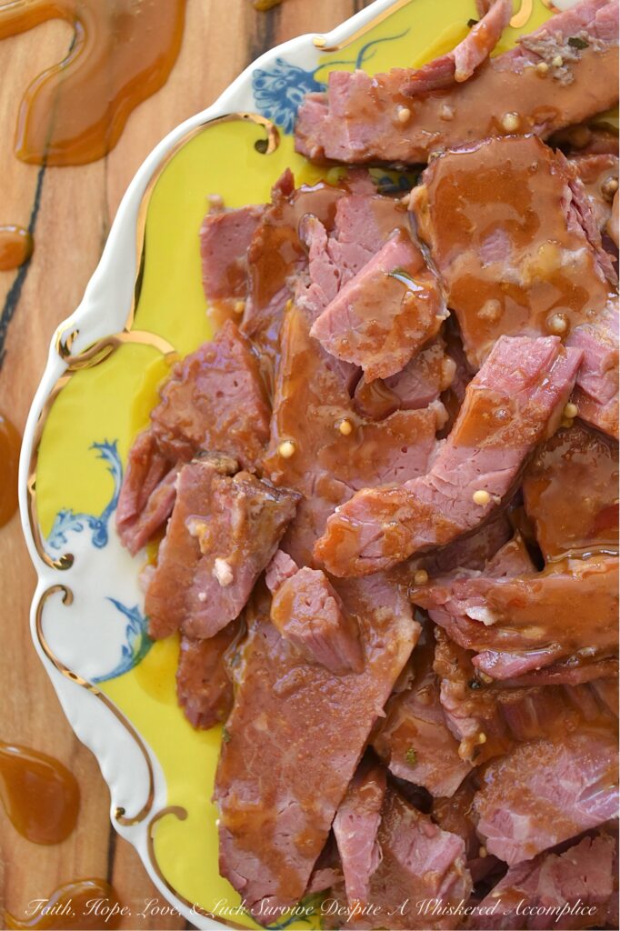 Maple Sugar Crockpot Corned Beef - Forget complicated cooking methods and lengthy ingredient lists; this incredibly easy slow cooker corned beef brisket recipe results in tender, melt-in-your-mouth corned beef with minimal effort. Simply place everything into your slow cooker, set it, and walk away. The real magic happens when the slowly cooked corned beef is glazed with a sweet and spicy mixture of brown sugar, Dijon mustard, maple syrup, and horseradish. A quick bake in the oven transforms this sauce into a golden, bubbly delight, creating a memorable corned beef dish that is sure to be a family favorite.
