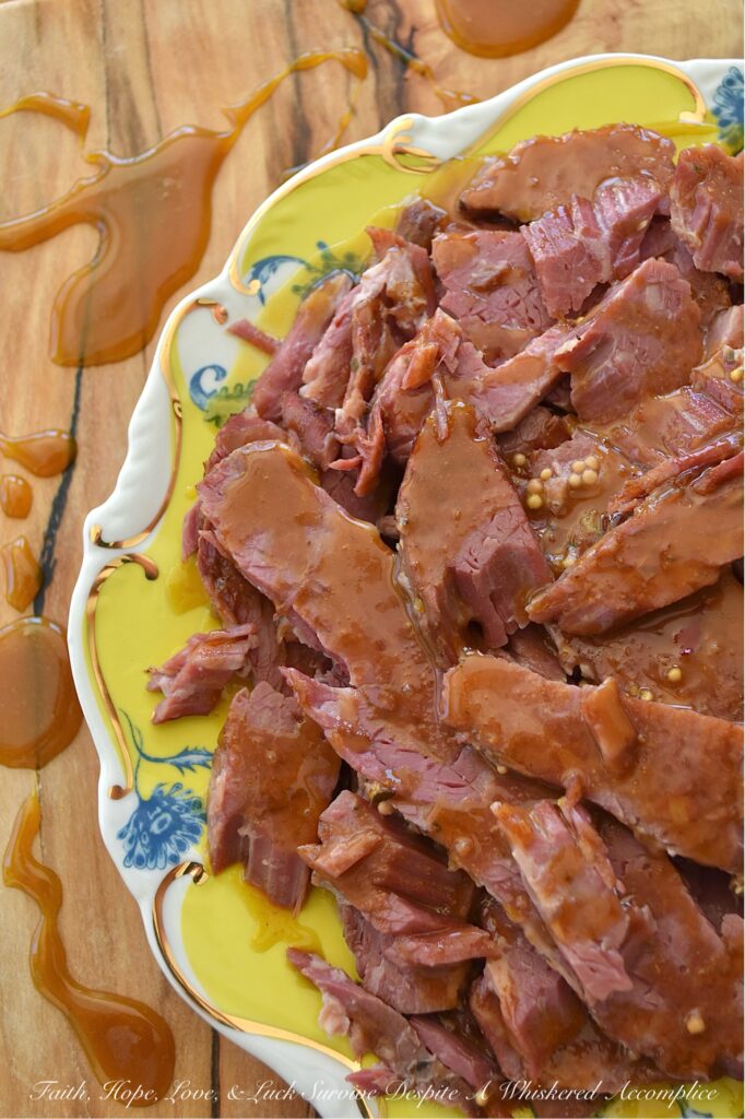 Maple Sugar Crockpot Corned Beef - Forget complicated cooking methods and lengthy ingredient lists; this incredibly easy slow cooker corned beef brisket recipe results in tender, melt-in-your-mouth corned beef with minimal effort. Simply place everything into your slow cooker, set it, and walk away. The real magic happens when the slowly cooked corned beef is glazed with a sweet and spicy mixture of brown sugar, Dijon mustard, maple syrup, and horseradish. A quick bake in the oven transforms this sauce into a golden, bubbly delight, creating a memorable corned beef dish that is sure to be a family favorite.