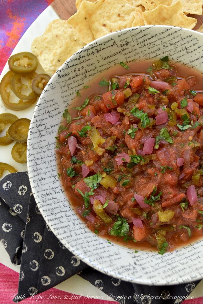 Sweet & Spicy Jalapeńo Canned Tomato Salsa - This simple recipe transforms a can of petite diced tomatoes into a vibrant, homemade salsa bursting with flavor. Savory garlic powder, onion powder, and smoky cumin are perfectly balanced by the zesty tang of pickled red onions and the delightful sweet heat of candied jalapeños. A touch of fresh cilantro and oregano adds a lovely pop of color and freshness, beautifully balancing all the flavors. Get ready to ditch your traditional, bland store-bought jar of salsa and embrace this easy-to-make homemade version that will have everyone asking for the recipe.