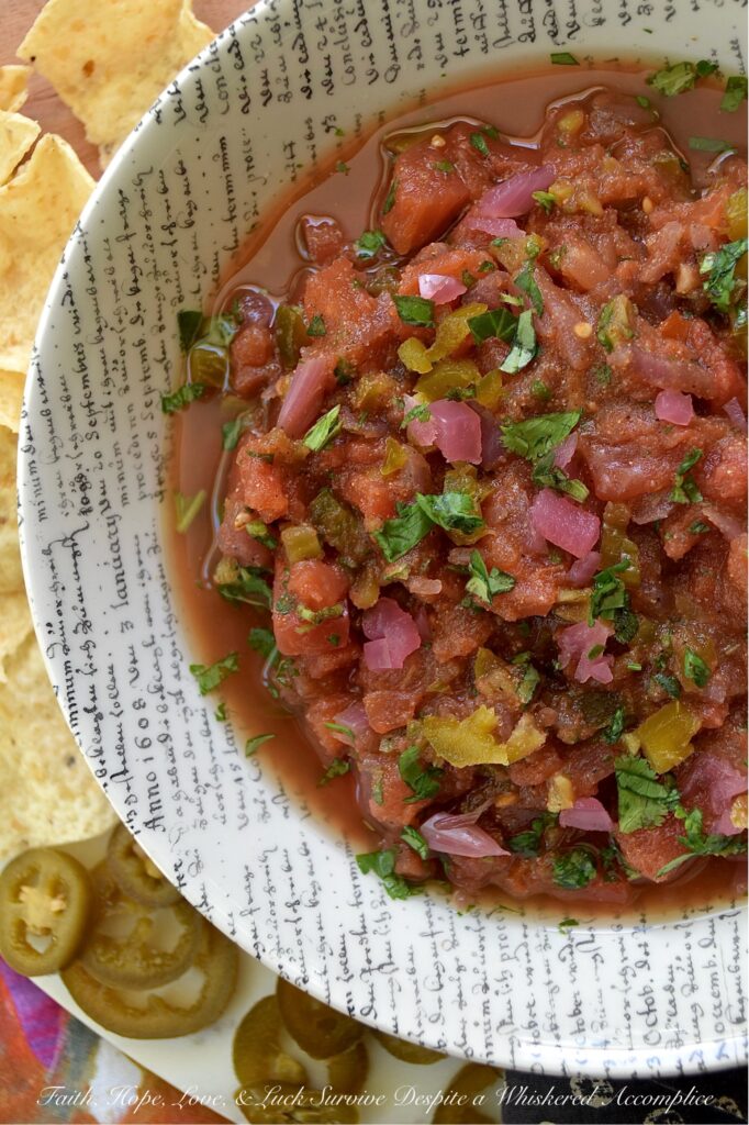 Sweet & Spicy Jalapeńo Canned Tomato Salsa - This simple recipe transforms a can of petite diced tomatoes into a vibrant, homemade salsa bursting with flavor. Savory garlic powder, onion powder, and smoky cumin are perfectly balanced by the zesty tang of pickled red onions and the delightful sweet heat of candied jalapeños. A touch of fresh cilantro and oregano adds a lovely pop of color and freshness, beautifully balancing all the flavors. Get ready to ditch your traditional, bland store-bought jar of salsa and embrace this easy-to-make homemade version that will have everyone asking for the recipe.
