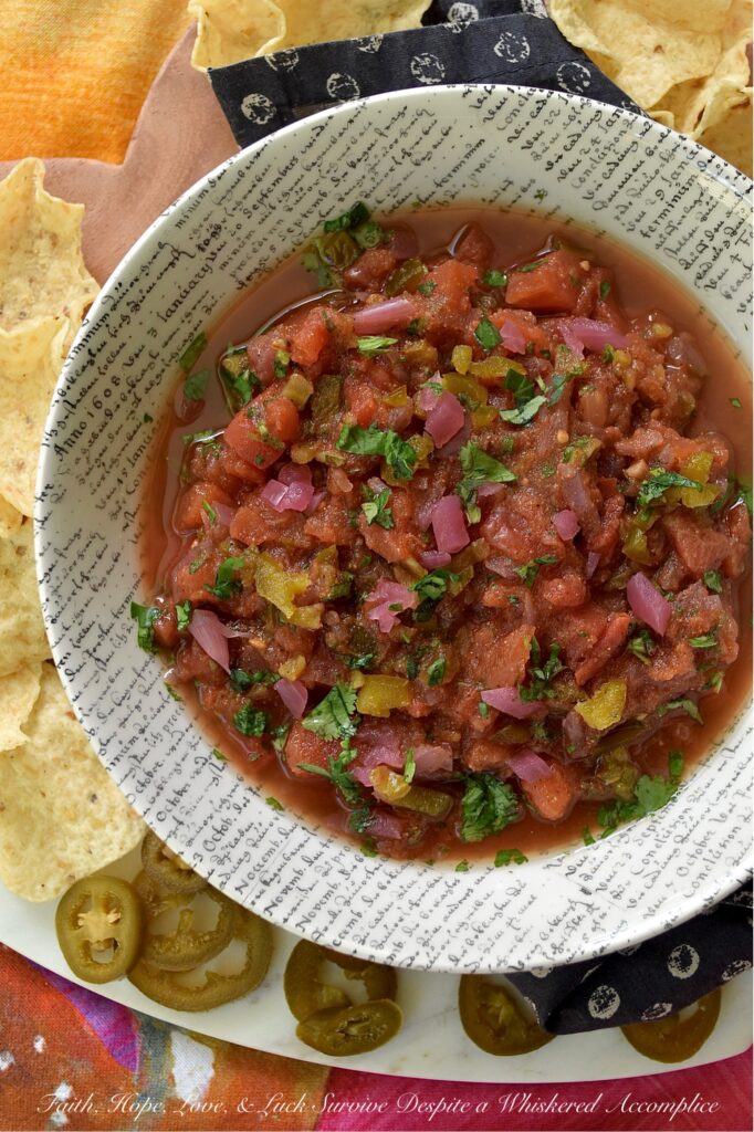Sweet & Spicy Jalapeńo Canned Tomato Salsa - This simple recipe transforms a can of petite diced tomatoes into a vibrant, homemade salsa bursting with flavor. Savory garlic powder, onion powder, and smoky cumin are perfectly balanced by the zesty tang of pickled red onions and the delightful sweet heat of candied jalapeños. A touch of fresh cilantro and oregano adds a lovely pop of color and freshness, beautifully balancing all the flavors. Get ready to ditch your traditional, bland store-bought jar of salsa and embrace this easy-to-make homemade version that will have everyone asking for the recipe.