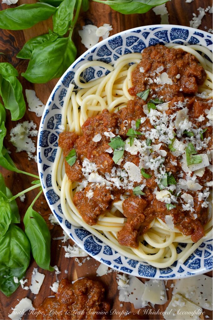 Nut-Free Basil Pesto Chunky Tomato Sauce - Forget bland, store-bought sauces. This recipe features the robust texture of canned petite diced tomatoes, slow-simmered to create a rich and hearty base. The secret ingredient? A bright and aromatic nut-free basil pesto, made with roasted salted pepitas for a unique, allergy-friendly, and satisfying twist on the classic. Perfect over a bed of pasta, draped over roasted vegetables, or as a vibrant base for your next homemade pizza, this meatless tomato sauce is packed with flavor and perfect for everyone at the table.
