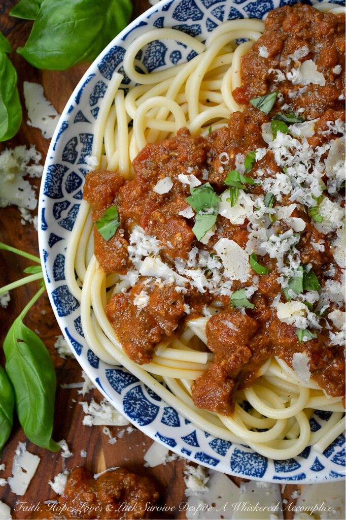 Nut-Free Basil Pesto Chunky Tomato Sauce - Forget bland, store-bought sauces. This recipe features the robust texture of canned petite diced tomatoes, slow-simmered to create a rich and hearty base. The secret ingredient? A bright and aromatic nut-free basil pesto, made with roasted salted pepitas for a unique, allergy-friendly, and satisfying twist on the classic. Perfect over a bed of pasta, draped over roasted vegetables, or as a vibrant base for your next homemade pizza, this meatless tomato sauce is packed with flavor and perfect for everyone at the table.