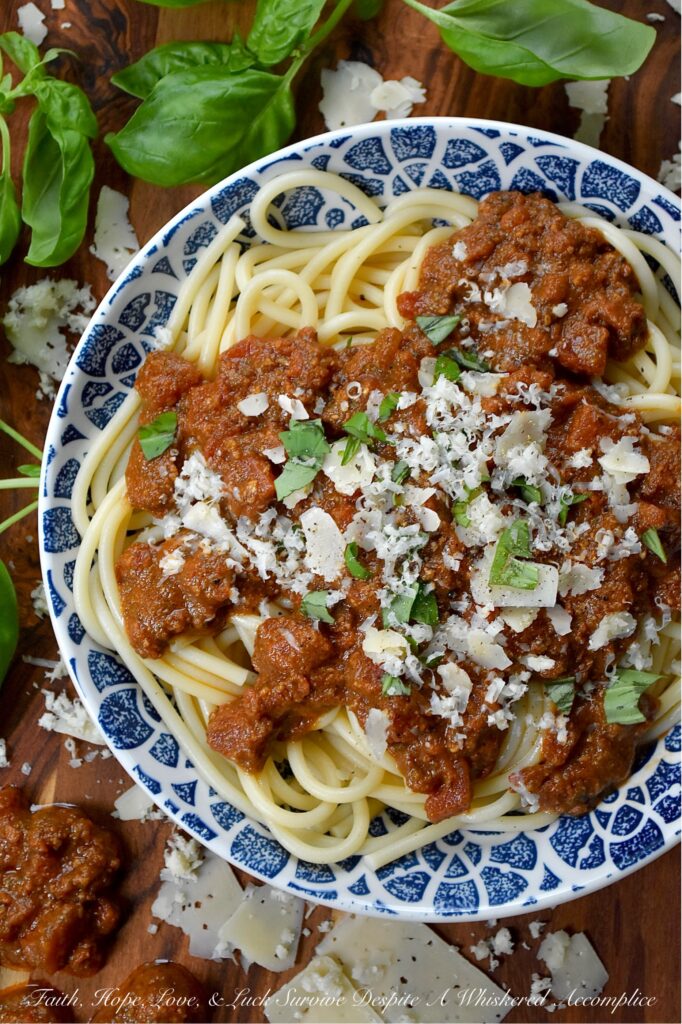 Nut-Free Basil Pesto Chunky Tomato Sauce - Forget bland, store-bought sauces. This recipe features the robust texture of canned petite diced tomatoes, slow-simmered to create a rich and hearty base. The secret ingredient? A bright and aromatic nut-free basil pesto, made with roasted salted pepitas for a unique, allergy-friendly, and satisfying twist on the classic. Perfect over a bed of pasta, draped over roasted vegetables, or as a vibrant base for your next homemade pizza, this meatless tomato sauce is packed with flavor and perfect for everyone at the table.