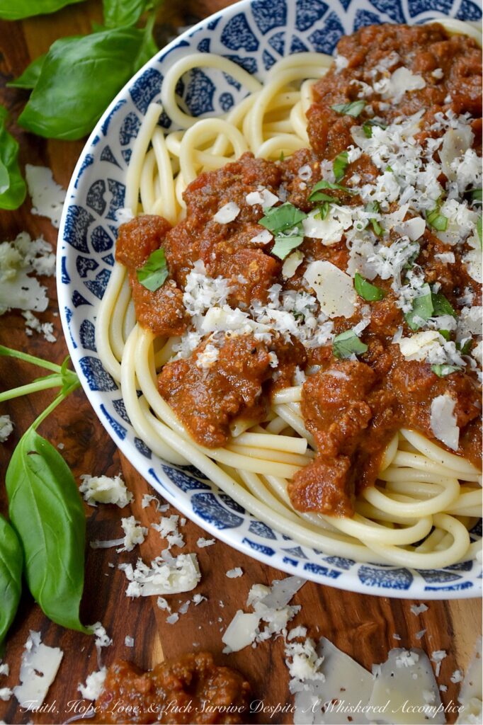 Nut-Free Basil Pesto Chunky Tomato Sauce - Forget bland, store-bought sauces. This recipe features the robust texture of canned petite diced tomatoes, slow-simmered to create a rich and hearty base. The secret ingredient? A bright and aromatic nut-free basil pesto, made with roasted salted pepitas for a unique, allergy-friendly, and satisfying twist on the classic. Perfect over a bed of pasta, draped over roasted vegetables, or as a vibrant base for your next homemade pizza, this meatless tomato sauce is packed with flavor and perfect for everyone at the table.