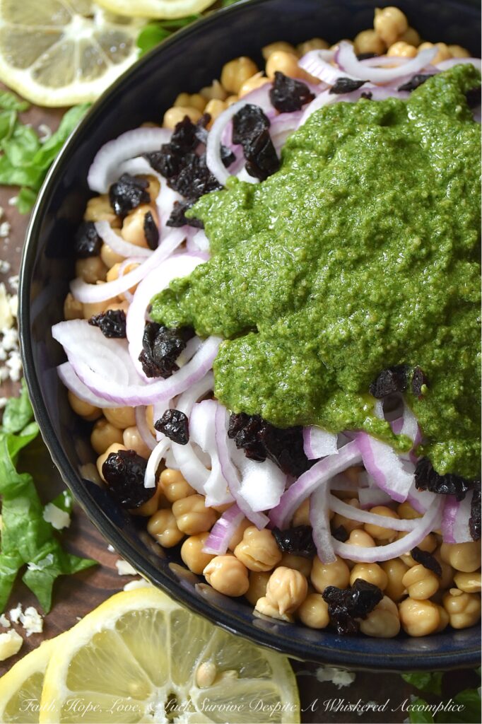 Chickpea Salad with Lemony Swiss Chard Pesto - If you're looking for a vibrant and flavorful side dish that is both easy to prepare and delicious, try this chickpea, red onion, and dried cherry salad. It's tossed in a bright, lemony pesto made with Swiss chard, salty parmesan cheese, lemon zest, and crunchy roasted pepitas. The best part? This recipe is incredibly versatile. You can easily swap out ingredients based on your preferences or what you have on hand. For example, you can use basil or spinach instead of Swiss chard, replace the pepitas with toasted pine nuts or walnuts, or substitute your favorite dried fruit for the cherries.