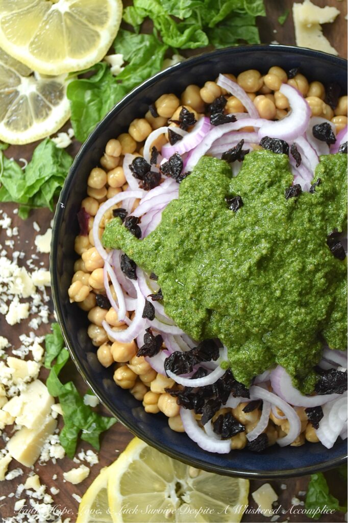 Chickpea Salad with Lemony Swiss Chard Pesto - If you're looking for a vibrant and flavorful side dish that is both easy to prepare and delicious, try this chickpea, red onion, and dried cherry salad. It's tossed in a bright, lemony pesto made with Swiss chard, salty parmesan cheese, lemon zest, and crunchy roasted pepitas. The best part? This recipe is incredibly versatile. You can easily swap out ingredients based on your preferences or what you have on hand. For example, you can use basil or spinach instead of Swiss chard, replace the pepitas with toasted pine nuts or walnuts, or substitute your favorite dried fruit for the cherries.