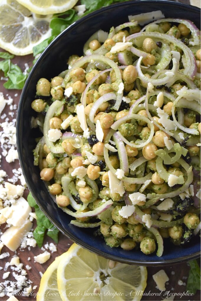 Chickpea Salad with Lemony Swiss Chard Pesto - If you're looking for a vibrant and flavorful side dish that is both easy to prepare and delicious, try this chickpea, red onion, and dried cherry salad. It's tossed in a bright, lemony pesto made with Swiss chard, salty parmesan cheese, lemon zest, and crunchy roasted pepitas. The best part? This recipe is incredibly versatile. You can easily swap out ingredients based on your preferences or what you have on hand. For example, you can use basil or spinach instead of Swiss chard, replace the pepitas with toasted pine nuts or walnuts, or substitute your favorite dried fruit for the cherries.