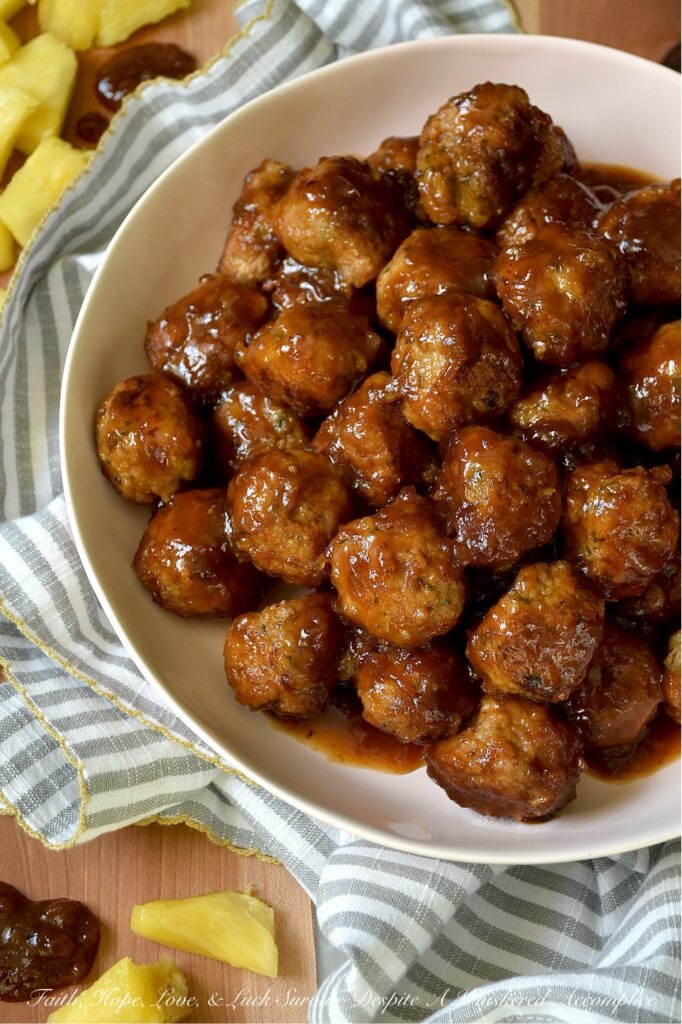 Pineapple Ketchup Ground Turkey Meatballs - This stovetop skillet turkey meatball recipe delivers juicy, tender ground turkey meatballs bursting with sweet and spicy goodness. But the real star of this dish is the sweet and spicy sauce, made with a quick homemade pineapple ketchup that adds an irresistible zing. Whether you're planning a weeknight dinner or searching for the perfect appetizer for your next party or game day gathering, these turkey meatballs are a versatile crowd-pleaser. Serve them solo, thread them onto skewers with fresh pineapple chunks, or pile them onto mini sliders for a truly unforgettable bite.