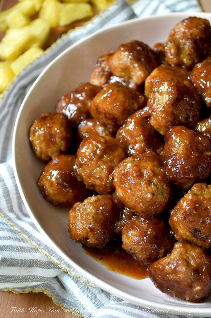 Pineapple Ketchup Ground Turkey Meatballs - This stovetop skillet turkey meatball recipe delivers juicy, tender ground turkey meatballs bursting with sweet and spicy goodness. But the real star of this dish is the sweet and spicy sauce, made with a quick homemade pineapple ketchup that adds an irresistible zing. Whether you're planning a weeknight dinner or searching for the perfect appetizer for your next party or game day gathering, these turkey meatballs are a versatile crowd-pleaser. Serve them solo, thread them onto skewers with fresh pineapple chunks, or pile them onto mini sliders for a truly unforgettable bite.