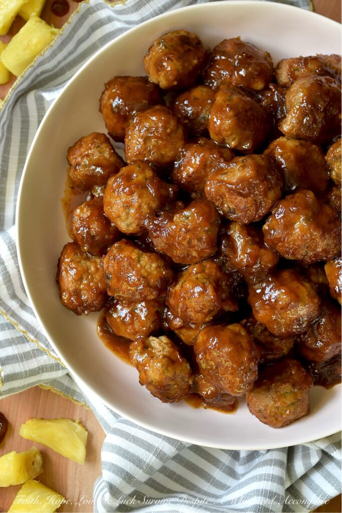 Pineapple Ketchup Ground Turkey Meatballs - This stovetop skillet turkey meatball recipe delivers juicy, tender ground turkey meatballs bursting with sweet and spicy goodness. But the real star of this dish is the sweet and spicy sauce, made with a quick homemade pineapple ketchup that adds an irresistible zing. Whether you're planning a weeknight dinner or searching for the perfect appetizer for your next party or game day gathering, these turkey meatballs are a versatile crowd-pleaser. Serve them solo, thread them onto skewers with fresh pineapple chunks, or pile them onto mini sliders for a truly unforgettable bite.