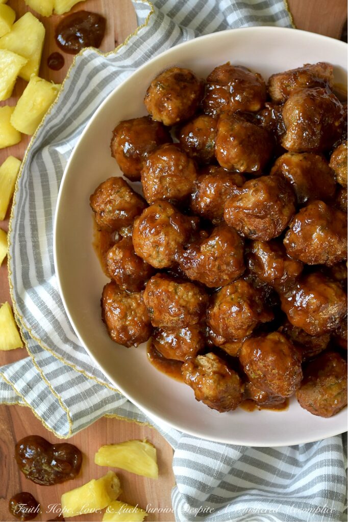 Pineapple Ketchup Ground Turkey Meatballs - This stovetop skillet turkey meatball recipe delivers juicy, tender ground turkey meatballs bursting with sweet and spicy goodness. But the real star of this dish is the sweet and spicy sauce, made with a quick homemade pineapple ketchup that adds an irresistible zing. Whether you're planning a weeknight dinner or searching for the perfect appetizer for your next party or game day gathering, these turkey meatballs are a versatile crowd-pleaser. Serve them solo, thread them onto skewers with fresh pineapple chunks, or pile them onto mini sliders for a truly unforgettable bite.