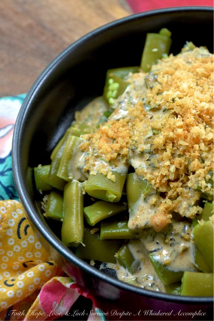 Fresh Basil Honey Mustard Flat Green Bean Salad - Imagine crisp, tender flat green beans dressed in a bright, homemade honey mustard dressing infused with the aromatic sweetness of fresh summer basil. Whether you're enjoying a casual backyard barbecue or a simple weeknight meal, this green bean salad, topped with a generous and crunchy sprinkle of toasted, buttery panko breadcrumbs, is sure to impress. Served chilled, at room temperature, or warmed, this summer side dish will have everyone coming back for seconds.