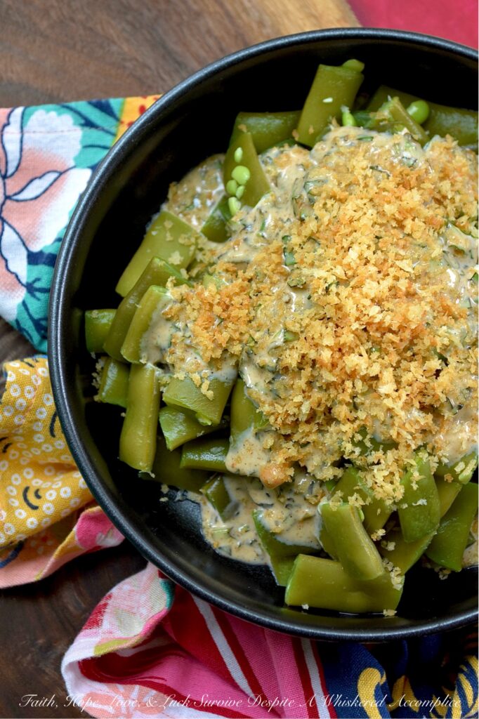 Fresh Basil Honey Mustard Flat Green Bean Salad - Imagine crisp, tender flat green beans dressed in a bright, homemade honey mustard dressing infused with the aromatic sweetness of fresh summer basil. Whether you're enjoying a casual backyard barbecue or a simple weeknight meal, this green bean salad, topped with a generous and crunchy sprinkle of toasted, buttery panko breadcrumbs, is sure to impress. Served chilled, at room temperature, or warmed, this summer side dish will have everyone coming back for seconds.