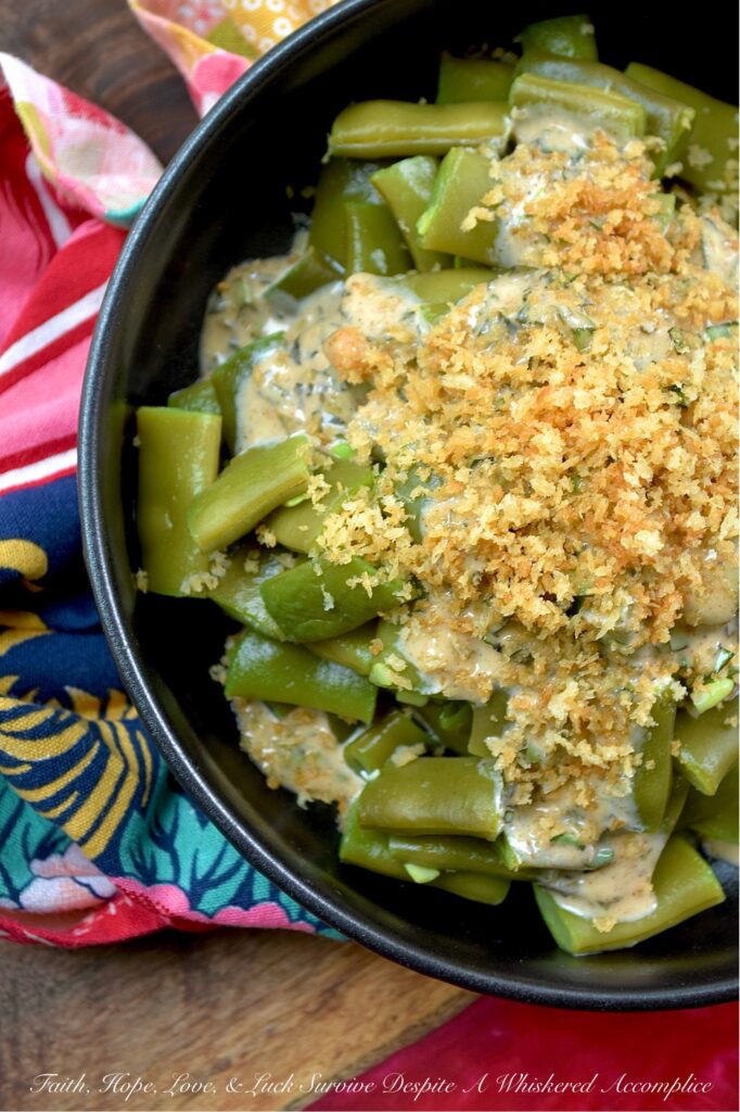 Fresh Basil Honey Mustard Flat Green Bean Salad - Imagine crisp, tender flat green beans dressed in a bright, homemade honey mustard dressing infused with the aromatic sweetness of fresh summer basil. Whether you're enjoying a casual backyard barbecue or a simple weeknight meal, this green bean salad, topped with a generous and crunchy sprinkle of toasted, buttery panko breadcrumbs, is sure to impress. Served chilled, at room temperature, or warmed, this summer side dish will have everyone coming back for seconds.