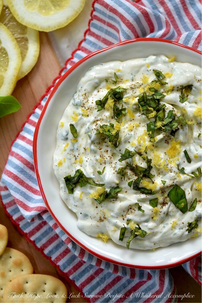 Whipped Feta with Lemon Zest & Fresh Basil - Whether you're hosting a sophisticated cocktail party, inviting friends over for a casual brunch, or simply seeking a delightful, creamy dip for a romantic movie night, this deceptively simple yet incredibly elegant dip is designed to impress with almost zero stress. When you combine the briny saltiness of feta cheese with the rich creaminess of cream cheese, you create something truly irresistible. Mixed to airy perfection and infused with bright lemon zest, fresh basil, and a hint of honey, this whipped feta not only looks stunning on any spread but pairs beautifully with everything from warm pita bread and crunchy pretzels to hearty focaccia and crisp baguette slices.