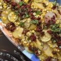 Sheet Pan Italian Olive Oil Summer Vegetables - Imagine thinly sliced potatoes, sweet onions, and tender zucchini mingling with bright corn kernels, all lightly coated with olive oil, salt, and pepper, then baked to tender, moist perfection. Once slightly cooled, these fresh summer vegetables are topped with a delicious Italian-inspired dressing made of bright olive oil, tangy balsamic vinegar, savory sun-dried tomatoes, and fragrant fresh basil. This healthy sheet pan bake demonstrates how simple ingredients, when thoughtfully combined, can create big, memorable flavors and an elegant presentation that will leave everyone eager to dig in.