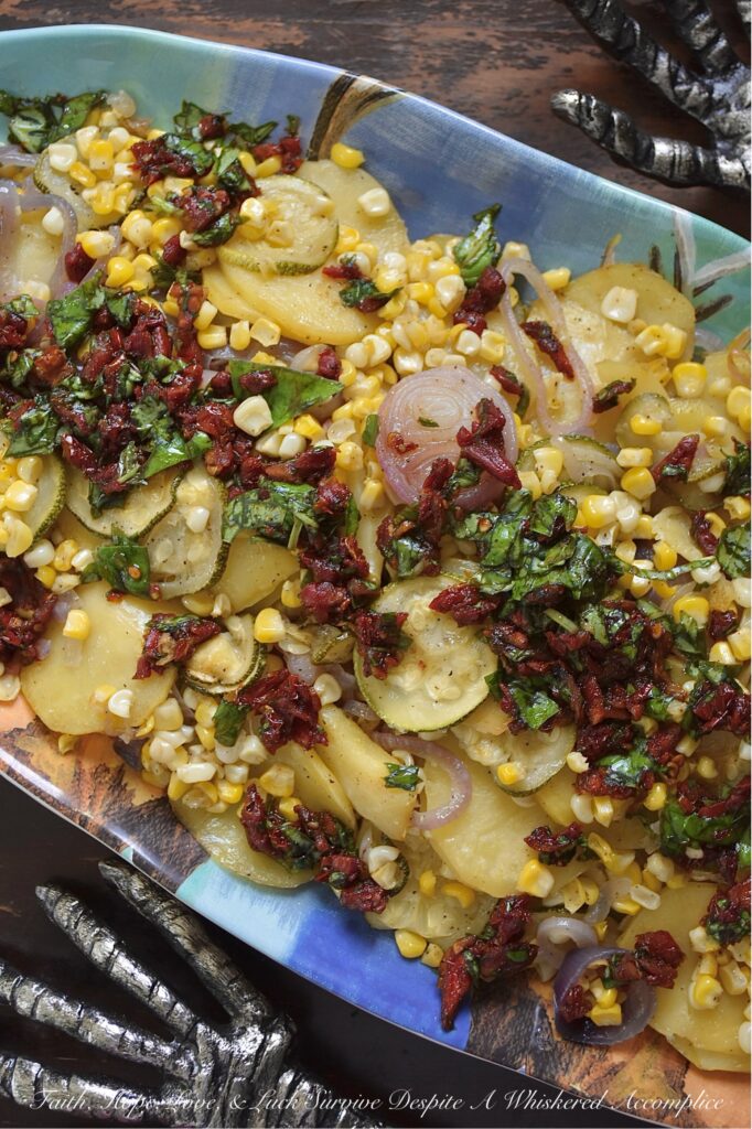 Sheet Pan Italian Olive Oil Summer Vegetables - Imagine thinly sliced potatoes, sweet onions, and tender zucchini mingling with bright corn kernels, all lightly coated with olive oil, salt, and pepper, then baked to tender, moist perfection. Once slightly cooled, these fresh summer vegetables are topped with a delicious Italian-inspired dressing made of bright olive oil, tangy balsamic vinegar, savory sun-dried tomatoes, and fragrant fresh basil. This healthy sheet pan bake demonstrates how simple ingredients, when thoughtfully combined, can create big, memorable flavors and an elegant presentation that will leave everyone eager to dig in.
