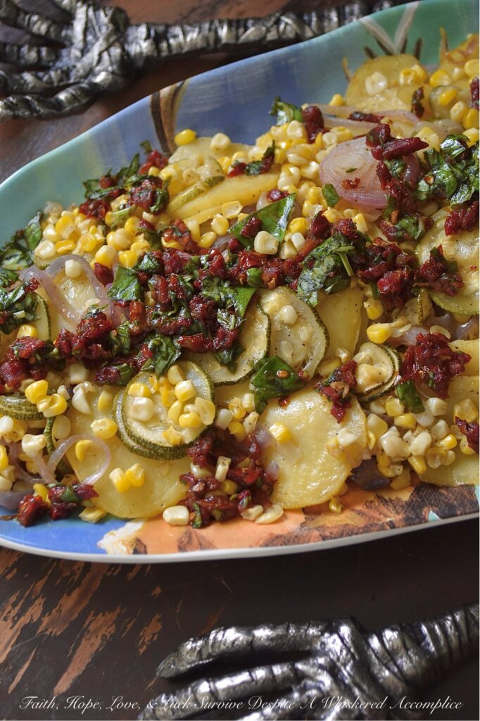 Sheet Pan Italian Olive Oil Summer Vegetables - Imagine thinly sliced potatoes, sweet onions, and tender zucchini mingling with bright corn kernels, all lightly coated with olive oil, salt, and pepper, then baked to tender, moist perfection. Once slightly cooled, these fresh summer vegetables are topped with a delicious Italian-inspired dressing made of bright olive oil, tangy balsamic vinegar, savory sun-dried tomatoes, and fragrant fresh basil. This healthy sheet pan bake demonstrates how simple ingredients, when thoughtfully combined, can create big, memorable flavors and an elegant presentation that will leave everyone eager to dig in.