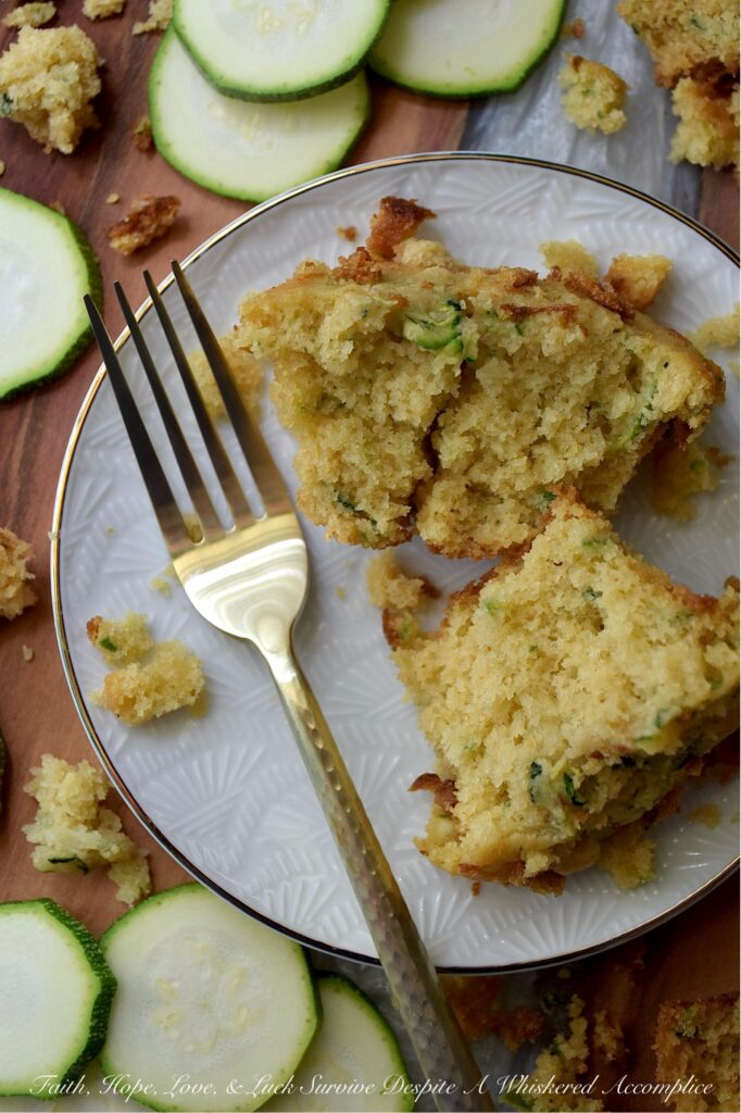 Zucchini Cornbread Muffins (Small-Batch Recipe) - When zucchini is in peak season, it's the perfect opportunity to whip up a batch of these zucchini cornbread muffins. These muffins are delicately sweet, wonderfully moist, and have just the right amount of crumbly texture. They are versatile enough to accompany any meal. Whether you're planning a lazy breakfast, a summer brunch gathering, or looking for the ideal side for a hearty bowl of homemade chili, these muffins are sure to be a hit. Don't be surprised if this small-batch recipe disappears in minutes; you might even want to consider baking a double batch.