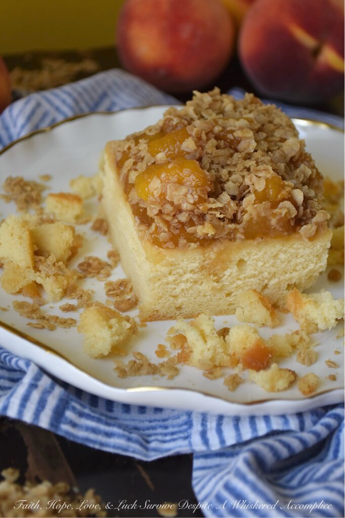 Peach Crumble Pound Cake (Cake Mix Recipe) - Say goodbye to complicated baking. This dreamy, moist pound cake is surprisingly simple to make with the help of a butter recipe yellow cake mix. Topped with luscious layers of a sweet brown sugar balsamic peach sauce and a delightful, crunchy oatmeal crumble, this peach crumble pound cake is the perfect peach recipe, whether you're using fresh, in-season peaches or enjoying a taste of summer with frozen ones. Designed to suit your needs, this cake can be baked as either two 8 x 8 square cakes or one large 9 x 13 rectangle. Whether you're hosting a backyard barbecue, attending a potluck, or looking for an irresistible, delicious fruity breakfast treat, this peach pound cake is guaranteed to be a crowd-pleaser for any occasion.