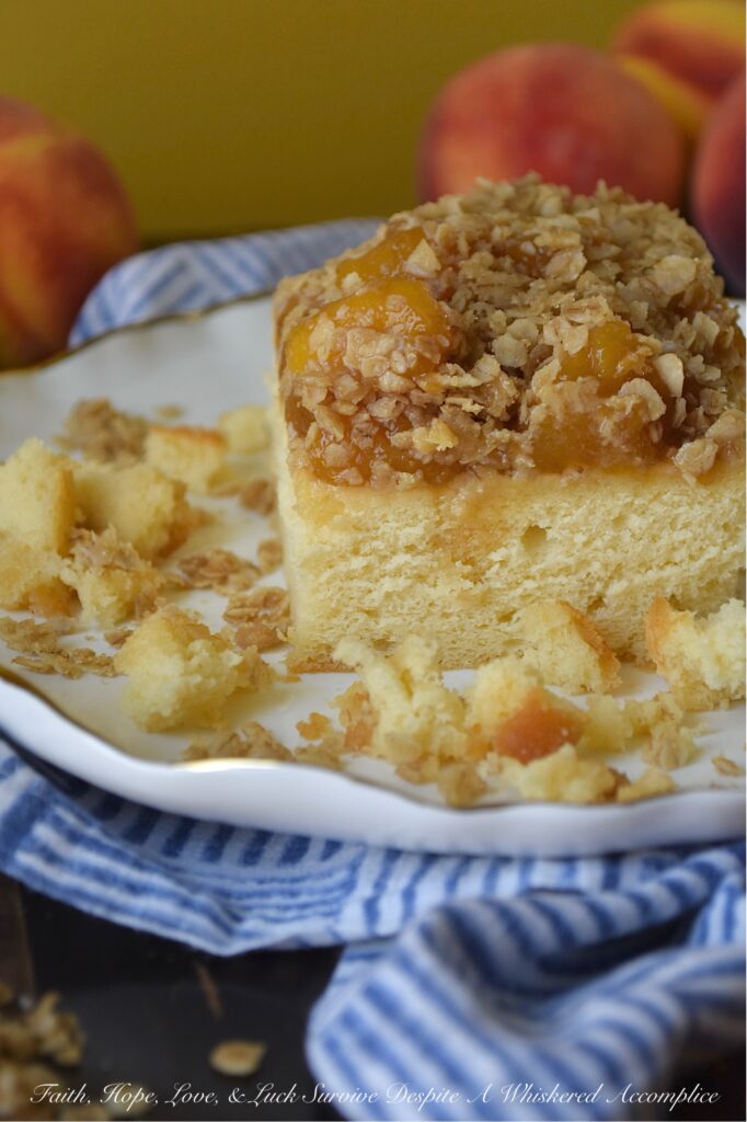 Peach Crumble Pound Cake (Cake Mix Recipe) - Say goodbye to complicated baking. This dreamy, moist pound cake is surprisingly simple to make with the help of a butter recipe yellow cake mix. Topped with luscious layers of a sweet brown sugar balsamic peach sauce and a delightful, crunchy oatmeal crumble, this peach crumble pound cake is the perfect peach recipe, whether you're using fresh, in-season peaches or enjoying a taste of summer with frozen ones. Designed to suit your needs, this cake can be baked as either two 8 x 8 square cakes or one large 9 x 13 rectangle. Whether you're hosting a backyard barbecue, attending a potluck, or looking for an irresistible, delicious fruity breakfast treat, this peach pound cake is guaranteed to be a crowd-pleaser for any occasion.