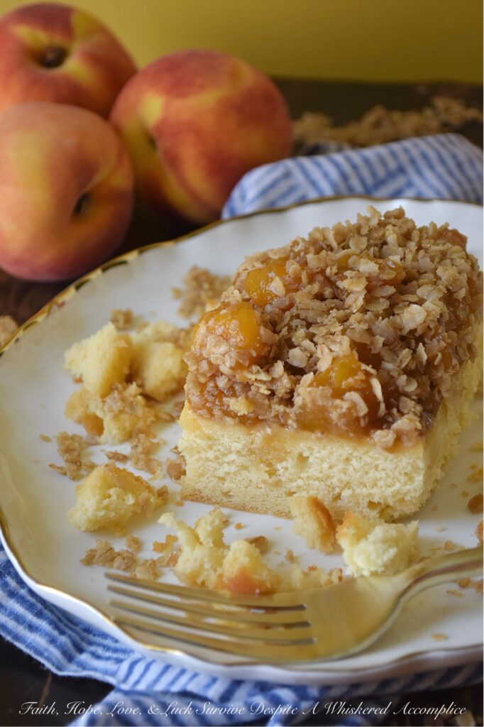 Peach Crumble Pound Cake (Cake Mix Recipe) - Say goodbye to complicated baking. This dreamy, moist pound cake is surprisingly simple to make with the help of a butter recipe yellow cake mix. Topped with luscious layers of a sweet brown sugar balsamic peach sauce and a delightful, crunchy oatmeal crumble, this peach crumble pound cake is the perfect peach recipe, whether you're using fresh, in-season peaches or enjoying a taste of summer with frozen ones. Designed to suit your needs, this cake can be baked as either two 8 x 8 square cakes or one large 9 x 13 rectangle. Whether you're hosting a backyard barbecue, attending a potluck, or looking for an irresistible, delicious fruity breakfast treat, this peach pound cake is guaranteed to be a crowd-pleaser for any occasion.