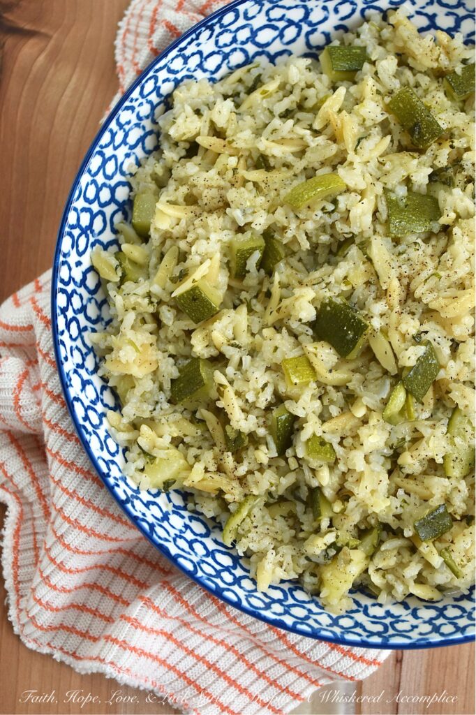 One-Pot Zucchini, Onion, & Cilantro Rice Pilaf - This one-pot rice and pasta pilaf perfectly marries fluffy jasmine rice with tender orzo pasta, creating a soft, buttery side dish that's truly a delight. With fresh cilantro, diced zucchini, and sweet sautéed yellow onion, it’s the ideal companion for everything from a simple weeknight meal to your favorite Mexican feasts. Best of all, it's a brilliant way to use up fresh summer zucchini and a guaranteed crowd-pleaser for even the toughest critics. And, if you have friends at your table who aren’t fans of cilantro, no worries. You can easily swap it out for some fresh parsley instead.