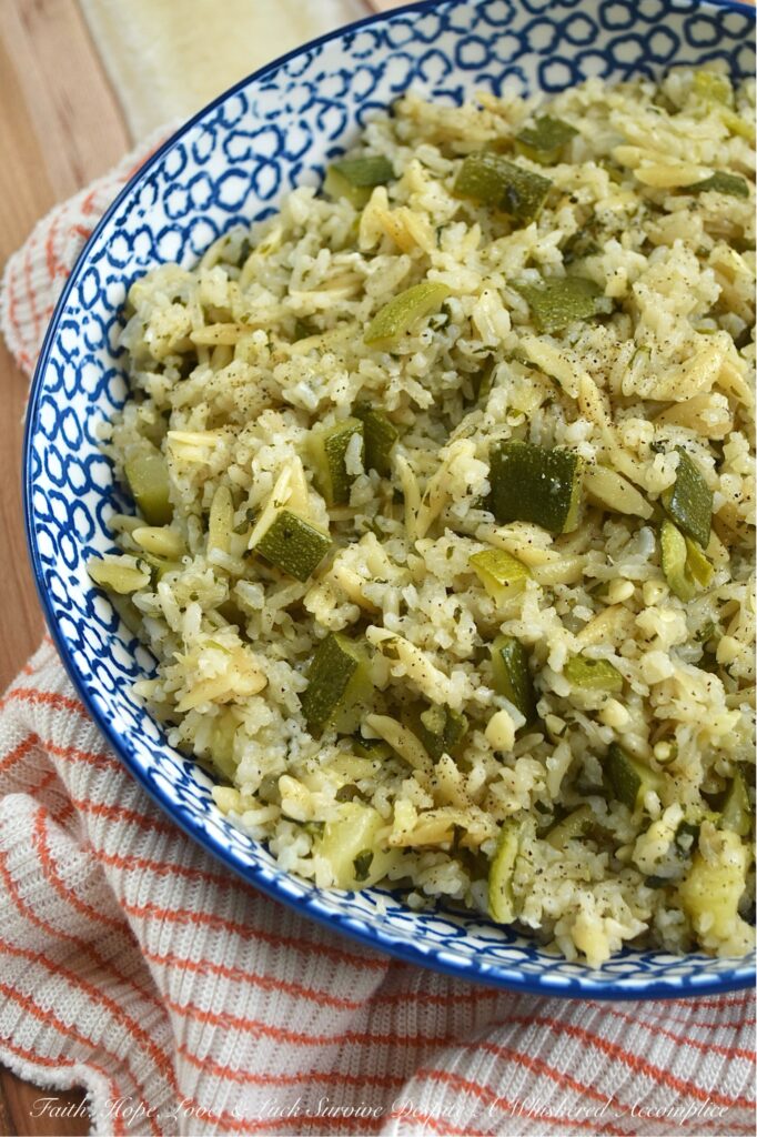 One-Pot Zucchini, Onion, & Cilantro Rice Pilaf - This one-pot rice and pasta pilaf perfectly marries fluffy jasmine rice with tender orzo pasta, creating a soft, buttery side dish that's truly a delight. With fresh cilantro, diced zucchini, and sweet sautéed yellow onion, it’s the ideal companion for everything from a simple weeknight meal to your favorite Mexican feasts. Best of all, it's a brilliant way to use up fresh summer zucchini and a guaranteed crowd-pleaser for even the toughest critics. And, if you have friends at your table who aren’t fans of cilantro, no worries. You can easily swap it out for some fresh parsley instead.