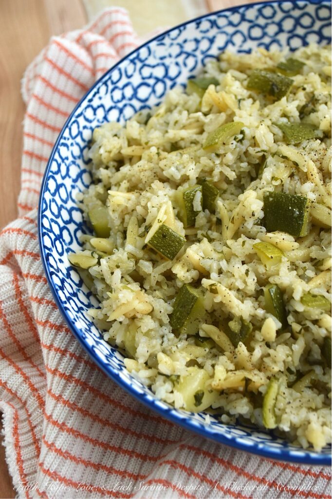 One-Pot Zucchini, Onion, & Cilantro Rice Pilaf - This one-pot rice and pasta pilaf perfectly marries fluffy jasmine rice with tender orzo pasta, creating a soft, buttery side dish that's truly a delight. With fresh cilantro, diced zucchini, and sweet sautéed yellow onion, it’s the ideal companion for everything from a simple weeknight meal to your favorite Mexican feasts. Best of all, it's a brilliant way to use up fresh summer zucchini and a guaranteed crowd-pleaser for even the toughest critics. And, if you have friends at your table who aren’t fans of cilantro, no worries. You can easily swap it out for some fresh parsley instead.