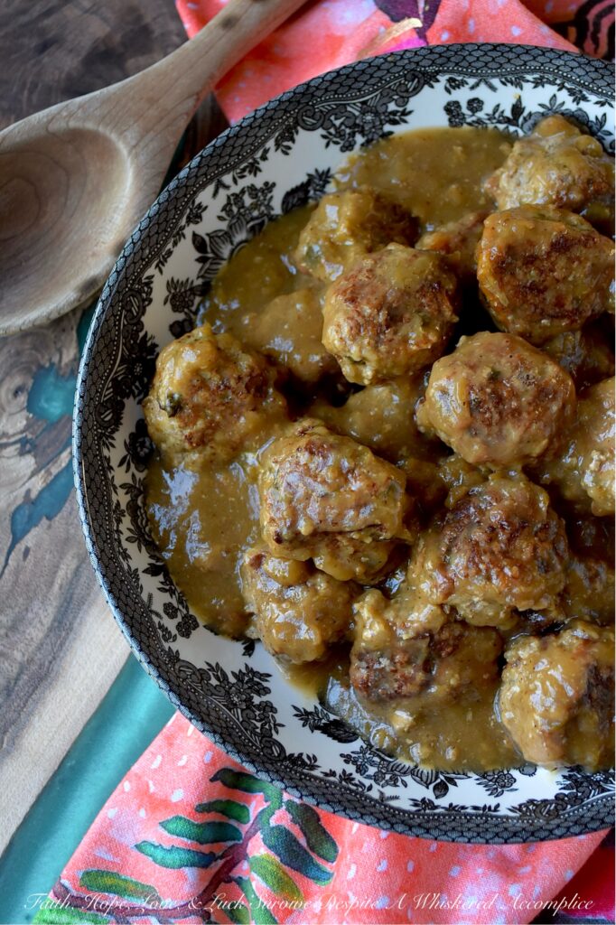 Saucy Green Chile & Beer Turkey Skillet Meatballs - Get ready to spice up your dinner routine with our Saucy Green Chile & Beer Skillet Meatballs. Tender ground turkey is gently mixed with a combination of flavorful taco seasoning, grated sweet yellow onion, a touch of cheddar cheese, and a generous helping of either fresh cilantro or fresh parsley. An egg and panko bread crumbs are also added to help bring everything together. After being browned to perfection, these savory turkey meatballs are then simmered in a unique and utterly delicious sauce combining beer and zesty green chile enchilada sauce. Served over rice, pasta, or mashed potatoes, these comforting, saucy stove-top skillet meatballs promise a family-friendly meal that is as easy to prepare as it is to enjoy.