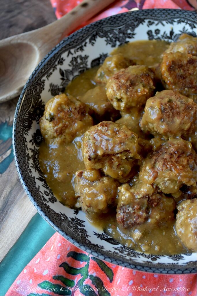 Saucy Green Chile & Beer Turkey Skillet Meatballs - Get ready to spice up your dinner routine with our Saucy Green Chile & Beer Skillet Meatballs. Tender ground turkey is gently mixed with a combination of flavorful taco seasoning, grated sweet yellow onion, a touch of cheddar cheese, and a generous helping of either fresh cilantro or fresh parsley. An egg and panko bread crumbs are also added to help bring everything together. After being browned to perfection, these savory turkey meatballs are then simmered in a unique and utterly delicious sauce combining beer and zesty green chile enchilada sauce. Served over rice, pasta, or mashed potatoes, these comforting, saucy stove-top skillet meatballs promise a family-friendly meal that is as easy to prepare as it is to enjoy.