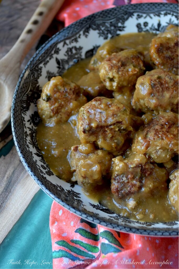 Saucy Green Chile & Beer Turkey Skillet Meatballs - Get ready to spice up your dinner routine with our Saucy Green Chile & Beer Skillet Meatballs. Tender ground turkey is gently mixed with a combination of flavorful taco seasoning, grated sweet yellow onion, a touch of cheddar cheese, and a generous helping of either fresh cilantro or fresh parsley. An egg and panko bread crumbs are also added to help bring everything together. After being browned to perfection, these savory turkey meatballs are then simmered in a unique and utterly delicious sauce combining beer and zesty green chile enchilada sauce. Served over rice, pasta, or mashed potatoes, these comforting, saucy stove-top skillet meatballs promise a family-friendly meal that is as easy to prepare as it is to enjoy.