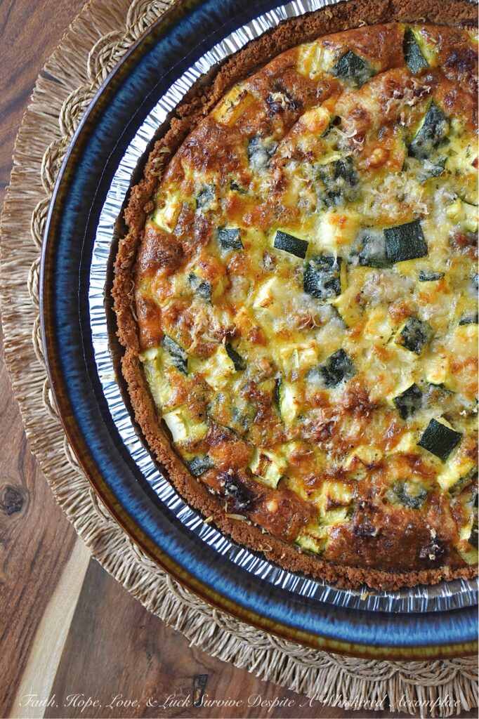 Italian Zucchini & Sausage Graham Cracker Quiche - Forget rolling out a pie crust or blind baking; our secret weapon for an effortless homemade quiche is a store-bought graham cracker crust. Yes, you read that right. This unexpected quiche base pairs perfectly with salty Parmesan cheese, flavorful browned sausage, tender diced zucchini, and a thick, creamy egg filling seasoned with an Italian herb seasoning mix. Whether you're searching for a sweet and savory breakfast idea, a show-stopping brunch recipe, or a uniquely satisfying idea for a weeknight dinner, this easy-to-assemble quiche is about to become your new secret weapon.