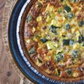 Italian Zucchini & Sausage Graham Cracker Quiche - Forget rolling out a pie crust or blind baking; our secret weapon for an effortless homemade quiche is a store-bought graham cracker crust. Yes, you read that right. This unexpected quiche base pairs perfectly with salty Parmesan cheese, flavorful browned sausage, tender diced zucchini, and a thick, creamy egg filling seasoned with an Italian herb seasoning mix. Whether you're searching for a sweet and savory breakfast idea, a show-stopping brunch recipe, or a uniquely satisfying idea for a weeknight dinner, this easy-to-assemble quiche is about to become your new secret weapon.
