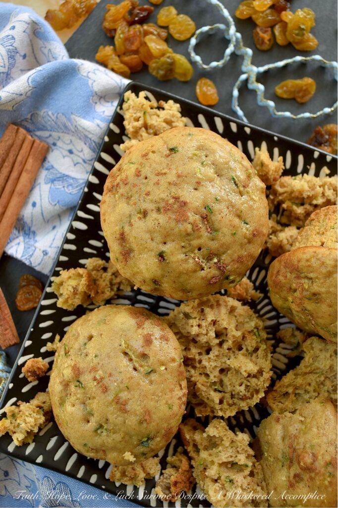 Cinnamon Raisin Vanilla Zucchini Bread Muffins - Got zucchini? Get ready for the best breakfast treat ever. These zucchini bread muffins aren't just good, they're incredibly soft and moist, thanks to the perfect combination of fresh grated zucchini and a box of vanilla instant pudding mix. Every soft, tender bite is full of warm, comforting ground cinnamon and sweet golden raisins, making these muffins the perfect way to start your morning. Seriously, if you have zucchini and love raisins, this is the muffin recipe you need to try.