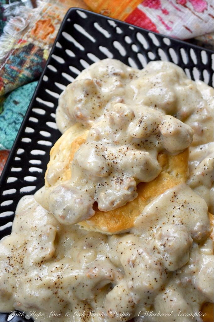 Weeknight Sweet Italian Sausage Gravy with Beer - Let's face it, some nights, making a complicated dinner just feels like too much. You're tired, hungry, and honestly, breakfast for dinner sounds much better and more comforting than heating up a frozen pizza. On those nights, this Weeknight Sweet Italian Sausage Gravy with Beer makes things a little easier and a whole lot tastier. This easy skillet recipe brings together sweet Italian sausage, beer, whole milk, and heavy cream to make a gravy that is rich, creamy, and a little sweet, simply seasoned with salt, pepper, and the flavor from the browned sausage. With this easy-to-make, delicious one-pan recipe, sausage gravy isn't just for breakfast anymore.